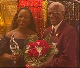 John Melbourne CHoF, Presenting Veronica Campbell-Brown CD, with Roses